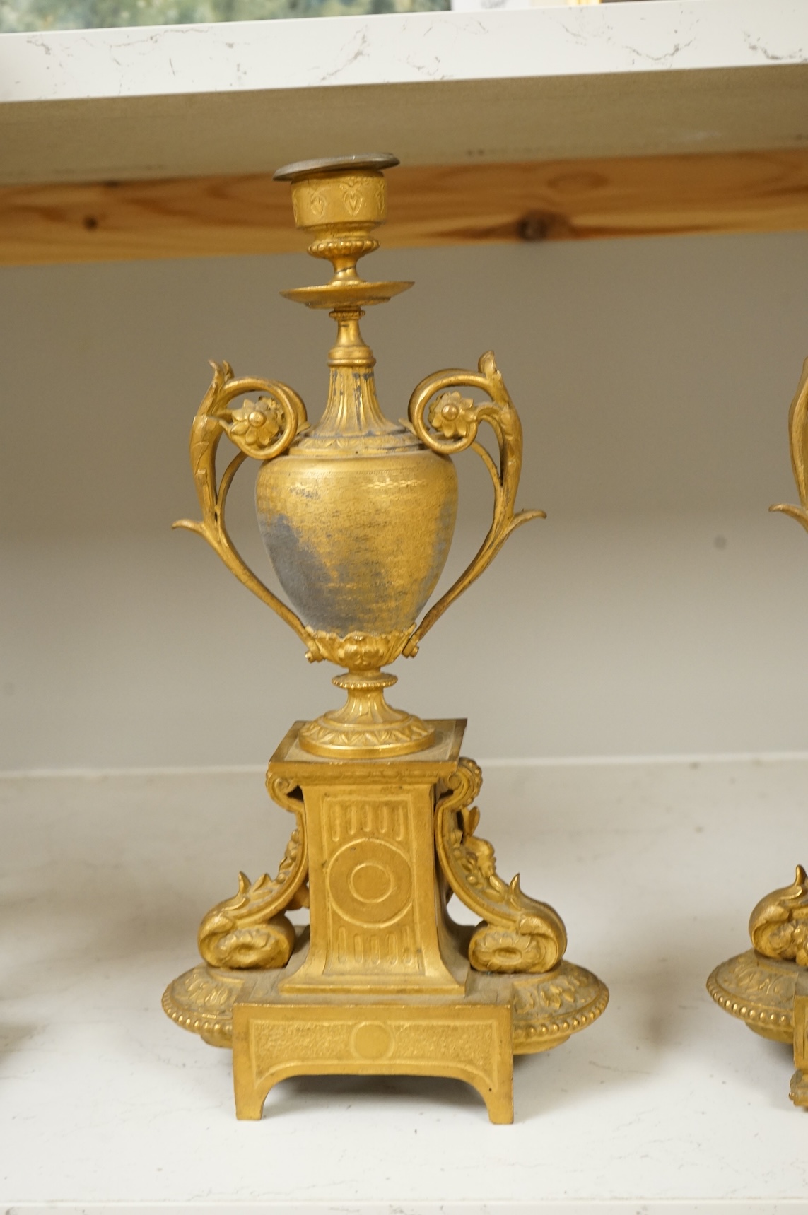 A pair of 19th century gilt metal candlesticks with inset porcelain panels, 32cm high